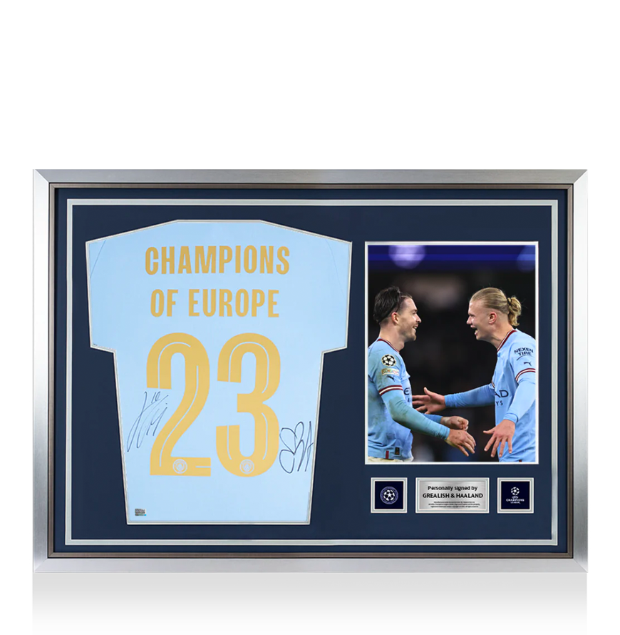 Jack Grealish &amp; Erling Haaland La UEFA Champions League oficial de la UEFA firmada y enmarcada Manchester City 2023-24 Camisa de casa: Campeones de Europa Edición