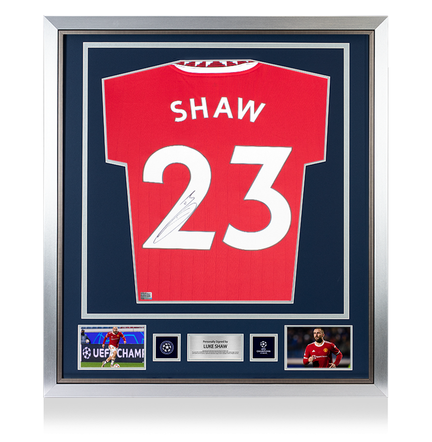 Luke Shaw Official UEFA Champions League Back Signed and Framed Manchester United 2022-23 Home Shirt with Fan Style Numbers UEFA Club Competitions Online Store